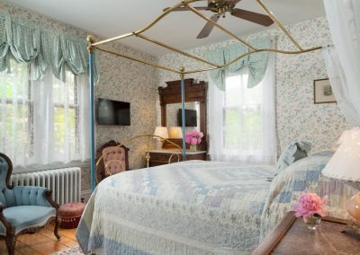 Bloomsbury Guestroom Bedroom is very bright and cheery with sun shining through three windows