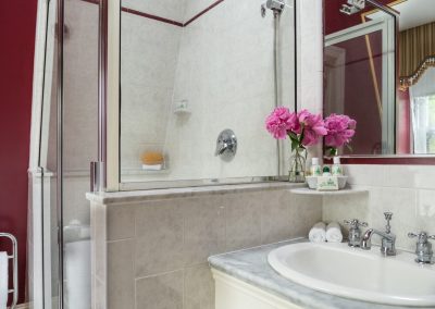 Crown Prince Guestroom Second Bathroom with Step-in shower and marble top sink counter