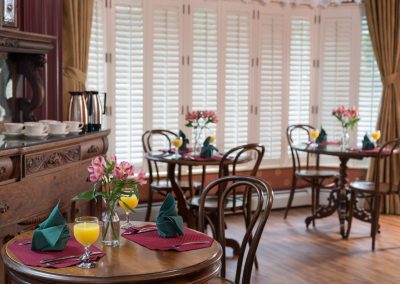 House of Royals Dining Room Beautiful Natural Lighting coming from a five window bay window, with private bistro seating