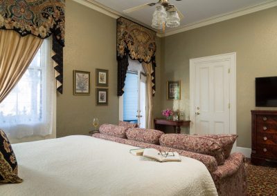 Lord Melbourne Guestroom with Camera Angle Showing the Entrance Door and Open Door to the Private Porch.