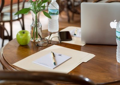 Picture of desk with Queen Victoria stationary and computer.