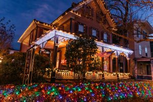 The Queen Victoria house candlelight home tour house with colored lights and hedge